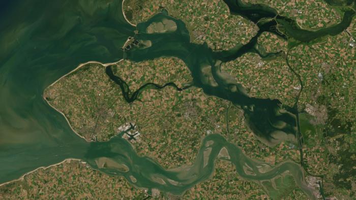 Satellite view of Zeeland, the Netherlands, featuring the Oosterschelde and Westerschelde, where clear water highlights the need for increased turbidity for coastal protection. Credit: basemaps, Esri, Maxar, Earthstar Geographics, and the GIS User Communi
