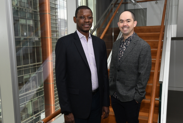 Dr. Lishomwa Ndhlovu and Dr. Michael Corley