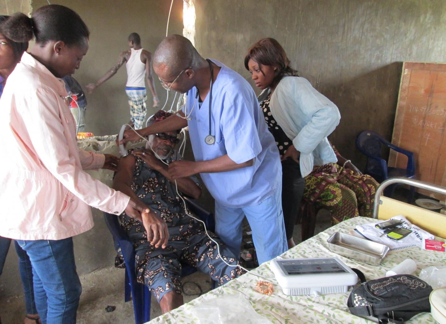 Dr. Felix Ikuomola Treats a Patient in Nigeria, January 2015