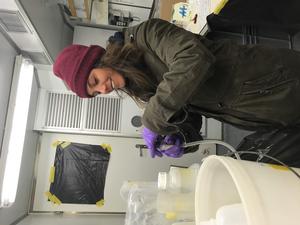 First author Zoe van Kemenade filtering sea water on RV Pelagia