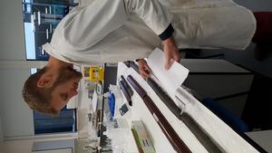 Dr Rush looking at the sediment core in the laboratory