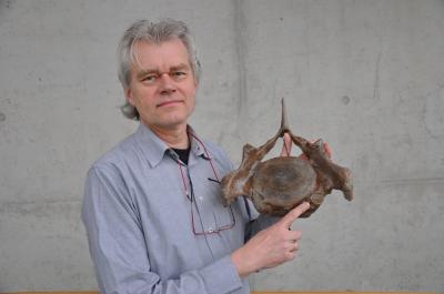 Dr. Reumer with One of the Cervical Vertebrae