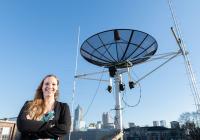 Mariel Borowitz with Satellite Downlink Dish (Alt Image)