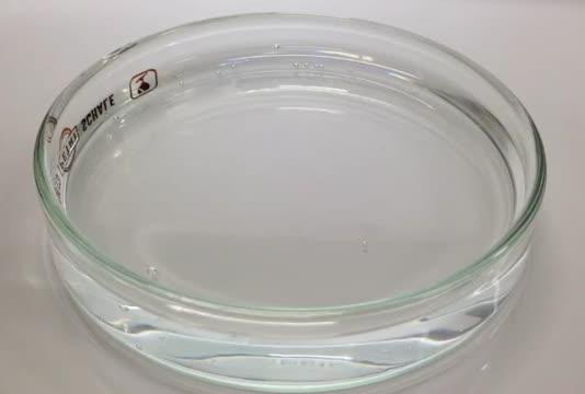 Deposition and Behavior of an Acetone Droplet on a 70 C Water Bath