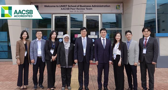 A photo of representatives from AACSB International and professors of Business Administration at UNIST.