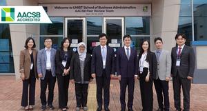 A photo of representatives from AACSB International and professors of Business Administration at UNIST.