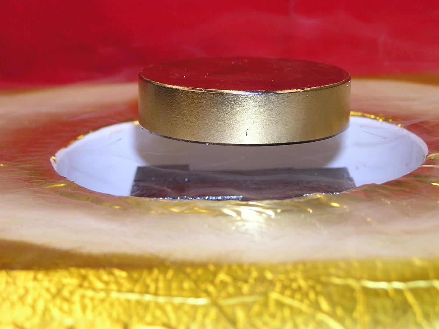 Magnet Levitated Over a High-Temperature Superconductor
