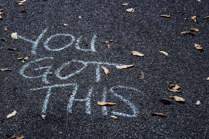 “You got this” written in chalk on pavement.