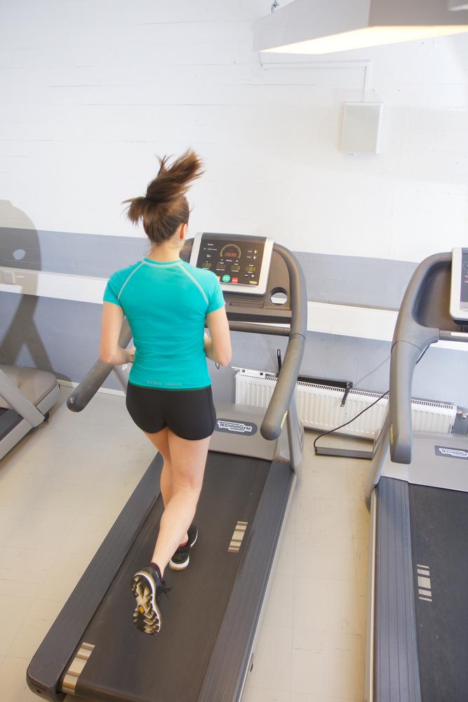 A Woman Running on a Treadmill