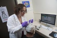 Sarah Laszlo Applies EEG Headset