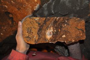 An intact block of dirt which holds evidence of animal and human occupations in Denisova cave in Siberia