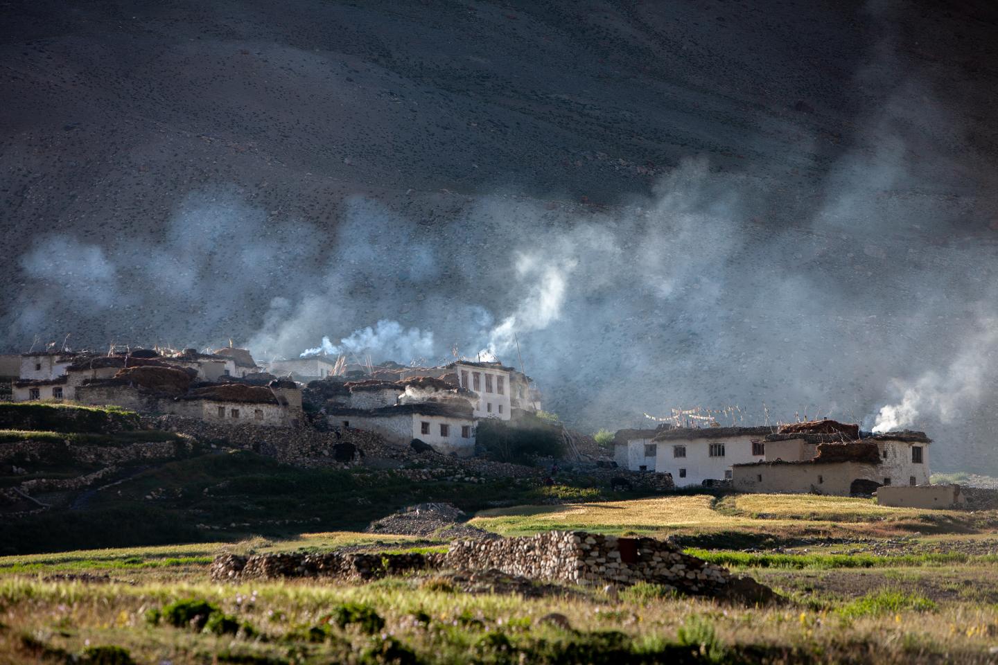 Smoke coming from village households in Ladakh, India.