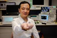 Zheng Yuanjin Holding the Tiny Radar Camera Chip on His Index Finger