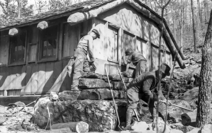 Members of the CCC work on the Devil’s Den bathhouse.