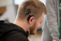 A young man with a cochlear implant.