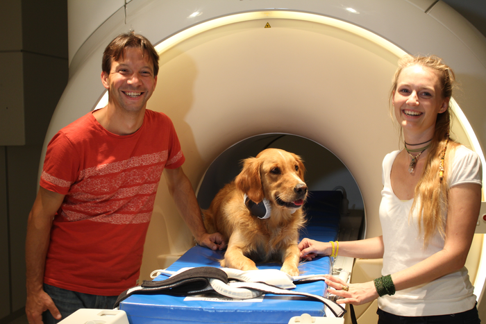 Trained dog with researchers at fMRI