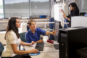 Lila Gierasch (center), professor of biochemistry and molecular biology at UMass Amherst