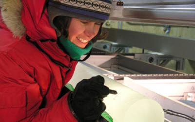 Researcher Inspects a Freshly-drilled Ice Core