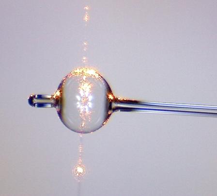 An Example of a Microbubble Resonator with an Optical Fibre Running Vertically Next to it to Excite 