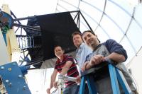 Members of the LCOGT / UCSB Supernova Team Next to an LCOGT 1m Telescope