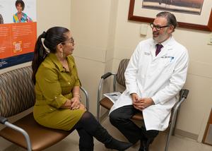 Maritza Cruz Rivera discusses progress with bariatric surgeon Andre Teixeira, MD, a year after undergoing bariatric surgery