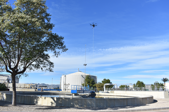 An electronic nose on a drone collecting air for odor measurement