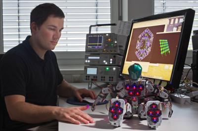 Researcher and Robot with Skin Elements