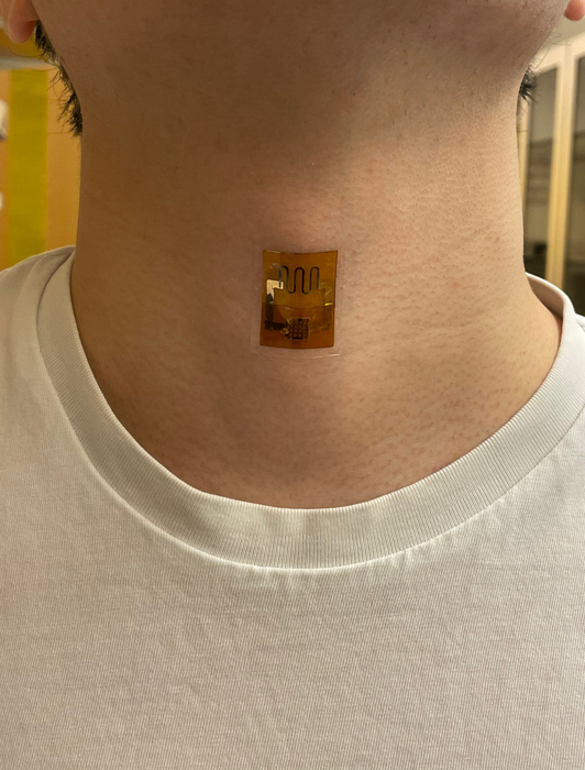 ?	A biofilm-powered sensor, on the neck, that measures the mechanical signal of swallowing.