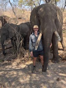 Lead author Patt Finnerty with elephant on fieldwork in South Africa