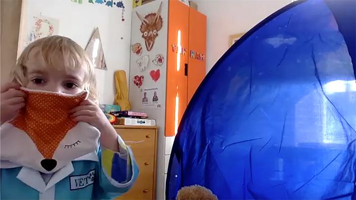 Olivia, age 3, demonstrates how she is keeping her stuffed animals safe from ‘germs’ using a makeshift face-mask. Image taken during Zoom conversation with lead researcher, Kelsey Graber.