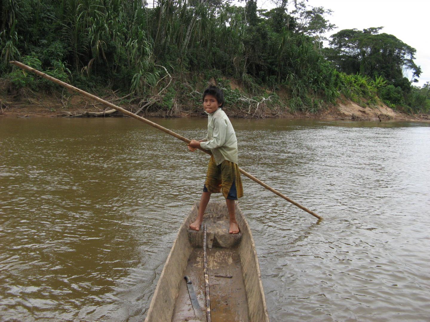 Tsimane child, in canoe