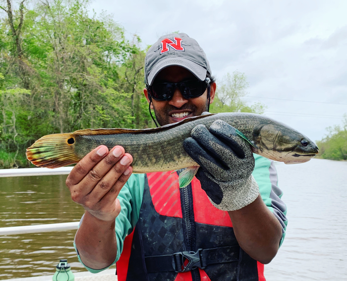 Fisheries ecologist Solomon David with bowfin