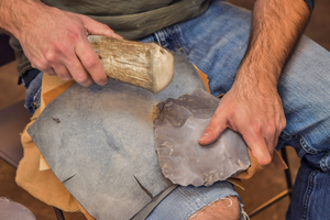 Metin Eren, Ph.D., associate professor and director of archeology at Kent State University, demonstrates flintknapping.