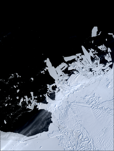the heavily crevassed front of Thwaites Glacier, West Antarctica, and icebergs and sea ice offshore.