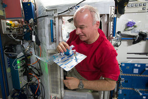 Astronaut Jeff Williams collects a breath sample