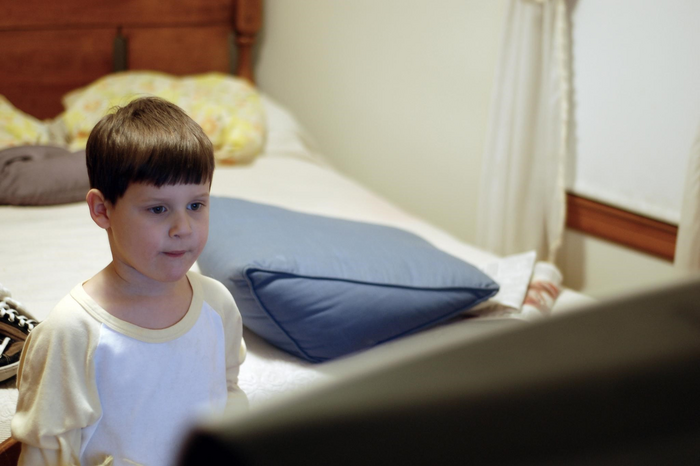 Figure1. A child watching television in the bedroom.