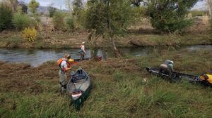 Preparing canoes to find salmon