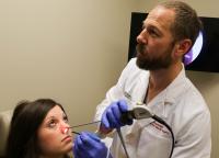 A Patient Undergoes The Non-Invasive Sinus Procedure