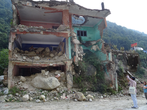 Building damaged by rockfalls during the 2015 Gorkha earthquake