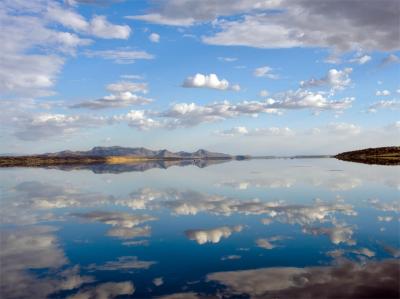 Seasonal Floods Change Lake Magadi from a White Salt Pan to a Shallow Mirror-Like Lake