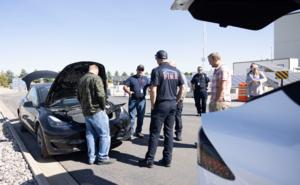 Workshop attendees interacting with INL’s research EVs.