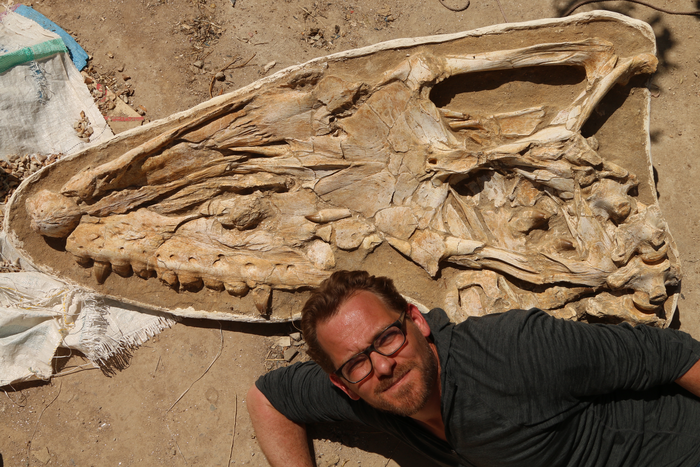 Nick Longrich with the mosasaur fossil