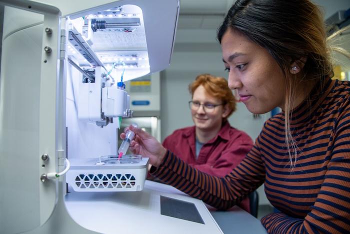 Undergraduate student researchers test samples in the Additive Biomanufacturing Lab at Keene State College