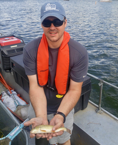 Fish ecologist Andrew Rypel with sucker fish