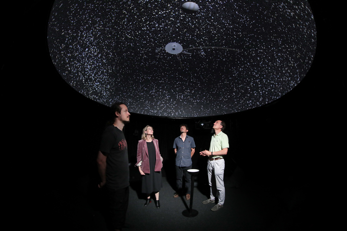 Under a dome showing the virtual universe