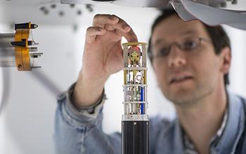 A Scientist Readies a Sample to Go Inside a Nuclear Magnetic Resonance Magnet