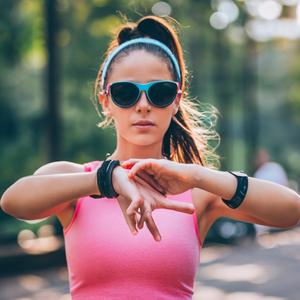 teenager looks at his physical activity wristband