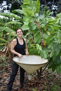 Researcher Sophie Müller holding a beating cone for the collection of arthropods on cacao plants.