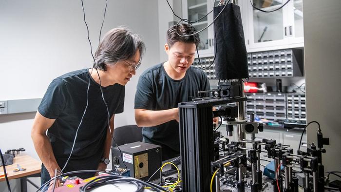 Prof. Jiwoong Park and scientist Hanyu Hong in the laser lab