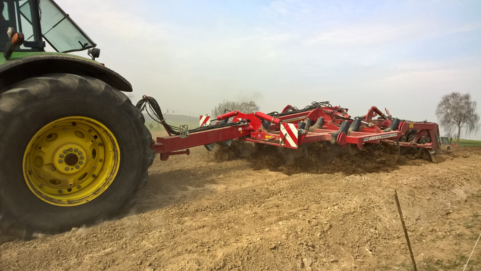 Soil tillage equipment moves large amount of material down slope as it is pulled through the soil